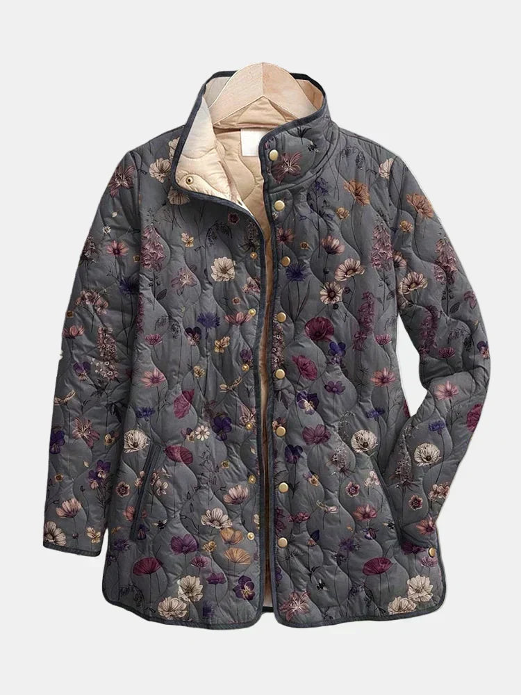 Graue Steppjacke mit Blumenmuster, Stehkragen und goldfarbenen Druckknöpfen, detail