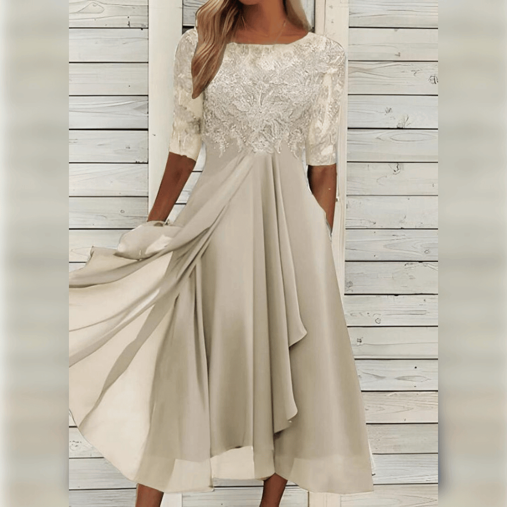 Elegantes cremefarbenes Spitzenkleid, knielang, mit halblangen Ärmeln, ideal für festliche Anlässe.