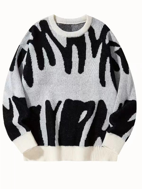 Strickpullover mit abstraktem Muster in Schwarz auf cremeweißem Grund, Vorderansicht flach ausgelegt 6