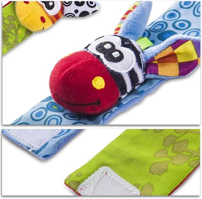Baby Hand und Fuß Rassel Socken Set mit rotem Zebragesicht und weißen Klettverschlüssen als Nahaufnahme