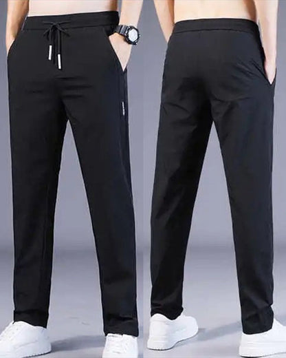 Schwarze Herren-Sporthose, elastisch, atmungsaktiv, mit Taschen, ideal für Fitness und Freizeit.