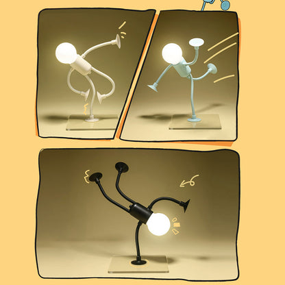 Drei Nachtlichter in Weiß, Hellblau und Schwarz in Comic-Rahmen, die in verschiedenen Tanz- und Kickposen auf transparenten Sockeln leuchten. 1