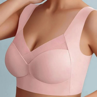 Getragener nahtloser BH in Rosa mit breiten Trägern und elastischem Einsatz im V-Ausschnitt, Nahaufnahme am Model. 15