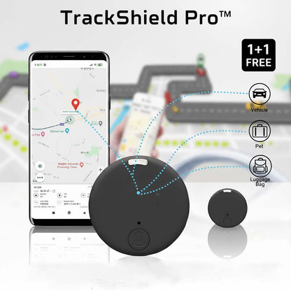 Zwei runde schwarze GPS-Tracker vor einem Smartphone mit Kartenansicht