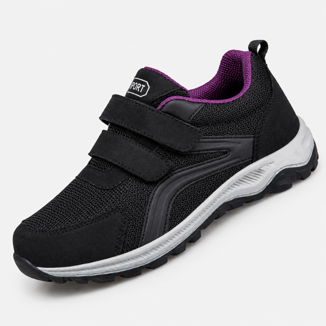 Einzelner schwarzer Schuh mit zwei Klettriemen, heller Sohle und violettem Innenfutter am Schaft 8
