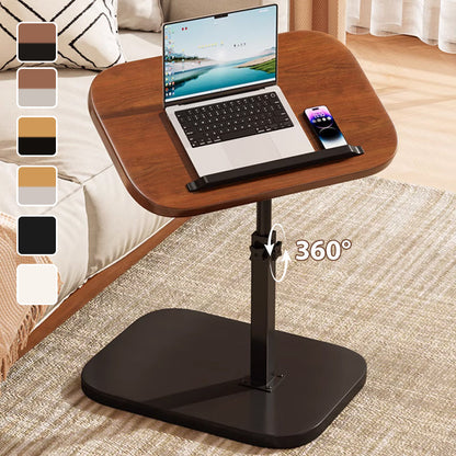 Höhenverstellbarer rollender Laptopschreibtisch mit schwarzem Gestell und dunkler Tischplatte neben dem Sofa
