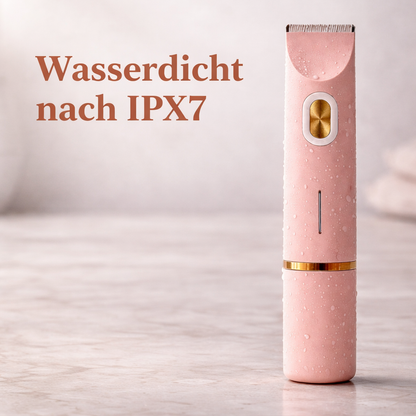 Rosa Trimmer mit Wassertropfen auf der Oberfläche steht auf einer Marmorplatte und zeigt die Wasserdichtigkeit.
