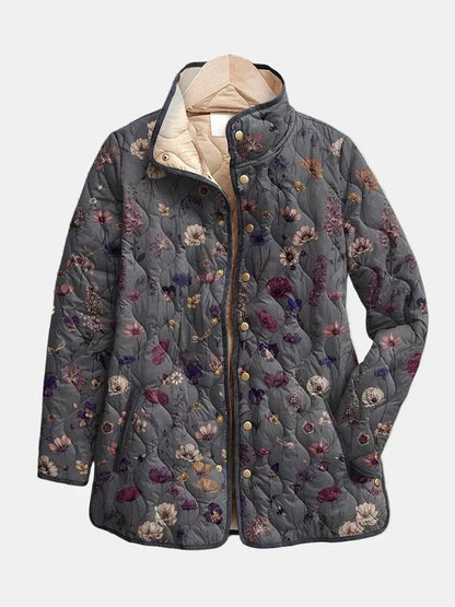 Graue Steppjacke mit Blumenmuster, Stehkragen und goldfarbenen Druckknöpfen, detail