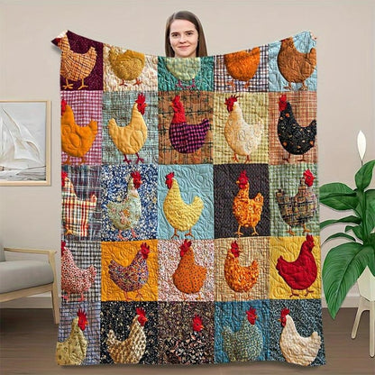 Frau hält die bunte Hühner-Patchworkdecke vor sich hoch und zeigt das gesamte Muster 2