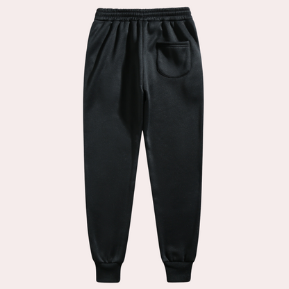 Schwarze Jogginghose, elastischer Bund, Seitentasche, Baumwolle, Herrenmode, bequem.