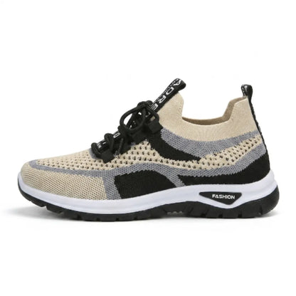 Seitenansicht des beige-schwarzen Mesh-Sneakers mit grauen Streifen, schwarzer Schnürung, weißer Zwischensohle und schwarzer Laufsohle 37