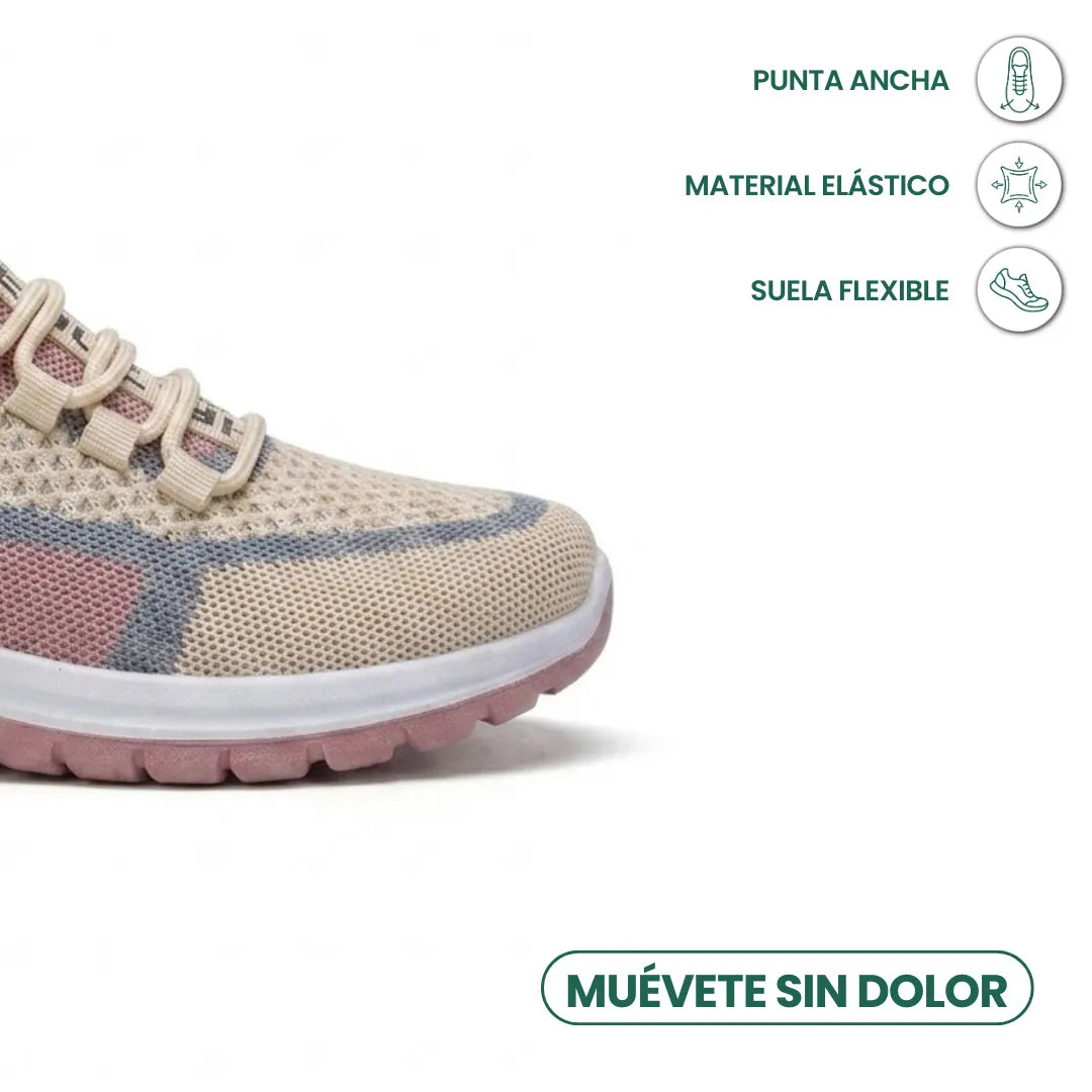 Vorderfuß des beigen Sneakers mit breiter Spitze, dehnbarem Material und flexibler Sohle, dazu Symbole 32