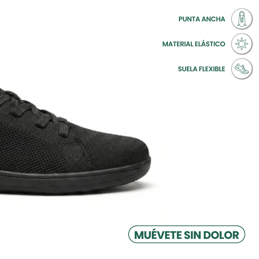 Schwarzer Sneaker, Zehenbereich im Anschnitt, daneben Symbole zu breiter Spitze, elastischem Material und flexibler Sohle. 14