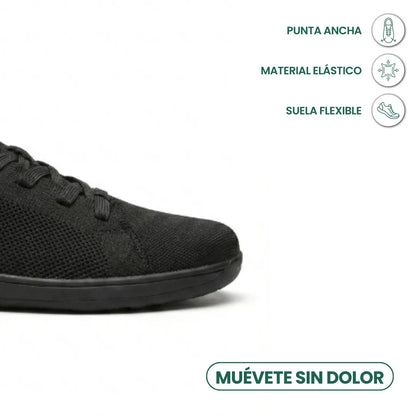 Schwarzer Sneaker, Zehenbereich im Anschnitt, daneben Symbole zu breiter Spitze, elastischem Material und flexibler Sohle. 14