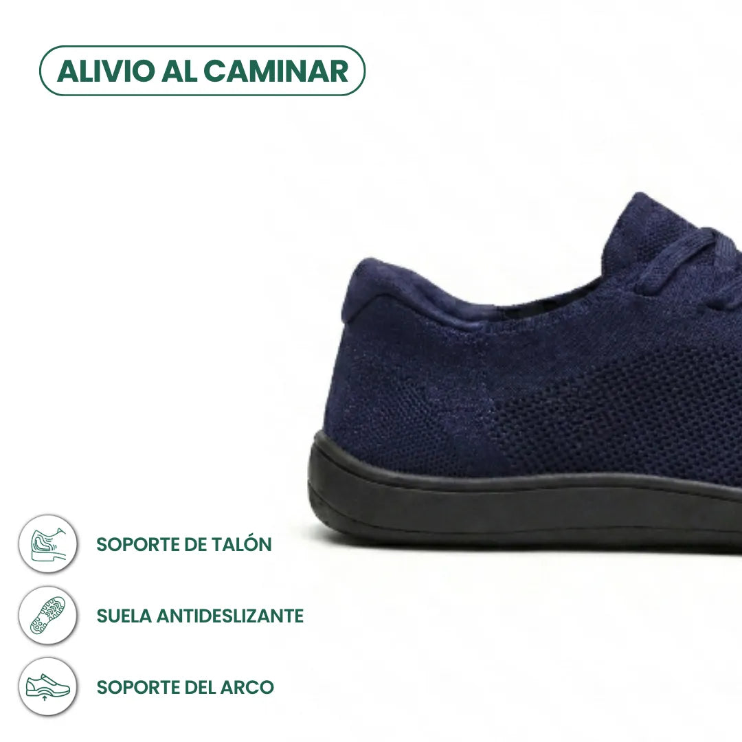 Seitliche Detailansicht der Ferse eines marineblauen Mesh-Sneakers mit schwarzer Sohle und Symbolen für Fersenhalt, rutschfeste Sohle und Fußgewölbestütze 22