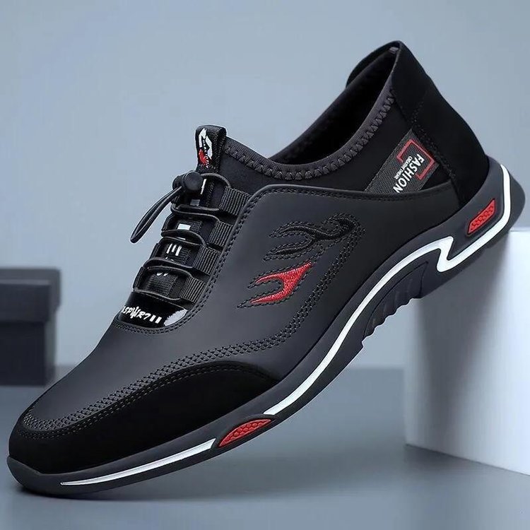 Schwarzer Herren-Sneaker, stilvoll, bequem, mit roten Akzenten, ideal für Freizeit und Sport.