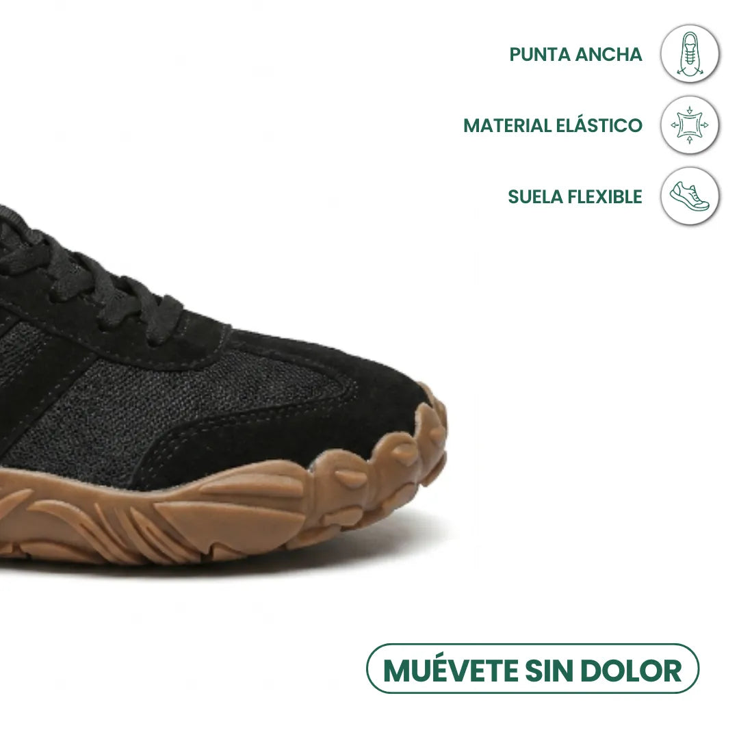 Schwarzer Schuh im Detail der breiten Spitze mit Mesh und Veloursleder, daneben Symbole für flexible Sohle und elastisches Material. 23
