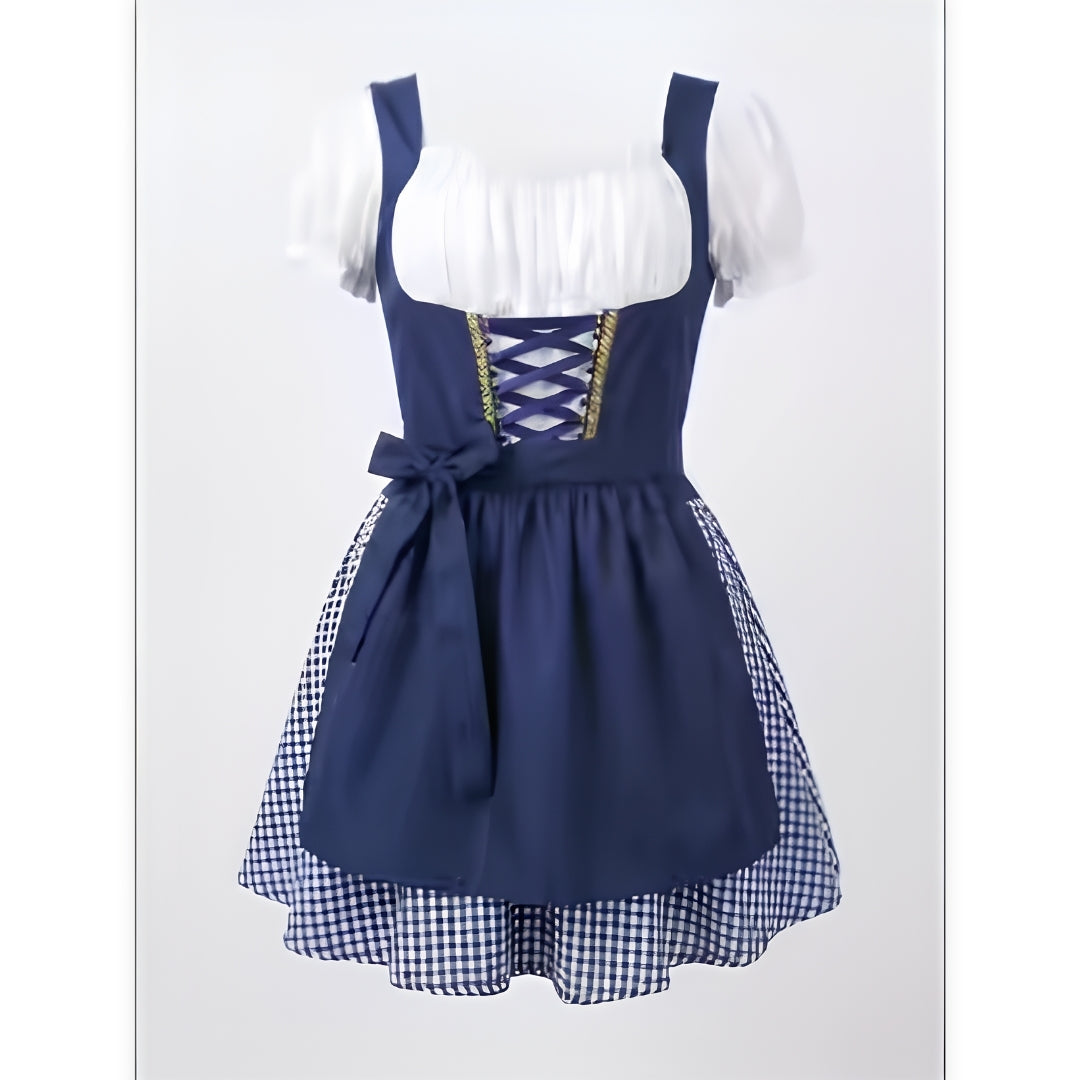 Dunkelblaues Dirndl mit weißer Bluse, violetter Schnürung, Schürze mit Schleife und blau-weiß kariertem Rock, einzeln fotografiert. 2