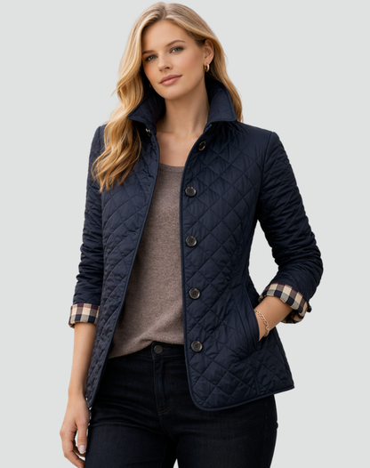 Marineblaue Steppjacke mit aufgestelltem Kragen und Rautensteppung