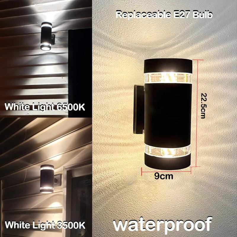 Kurze schwarze Außen-LED-Wandlampe mit klaren Ringen und Maßangaben in einer weiteren Ansicht.