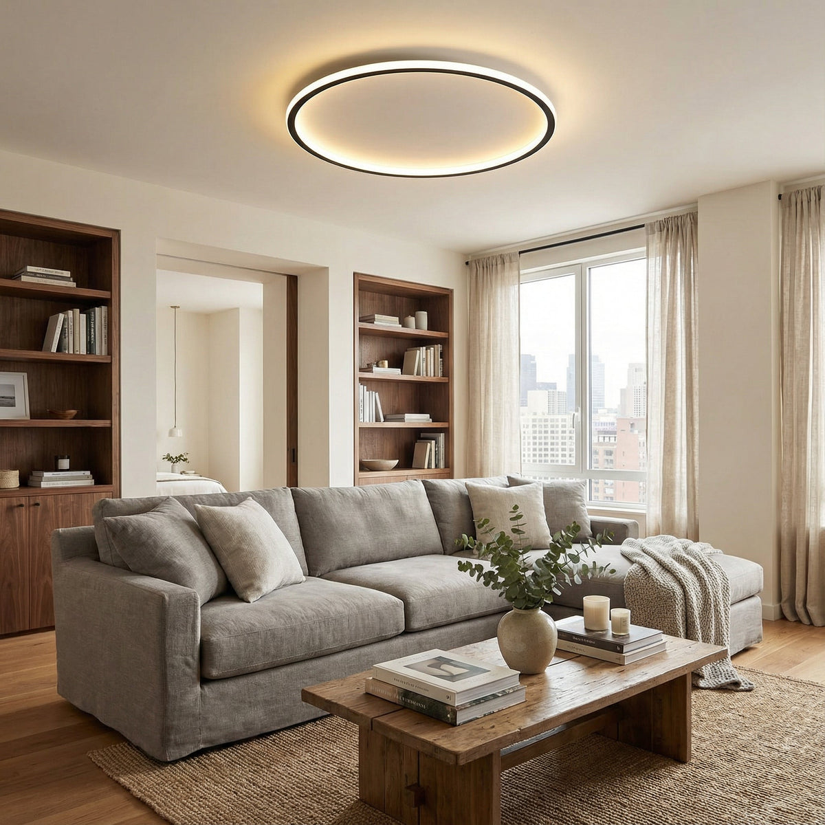 Schwarze runde LED-Deckenleuchte, weitere Ansicht im Wohnzimmer.