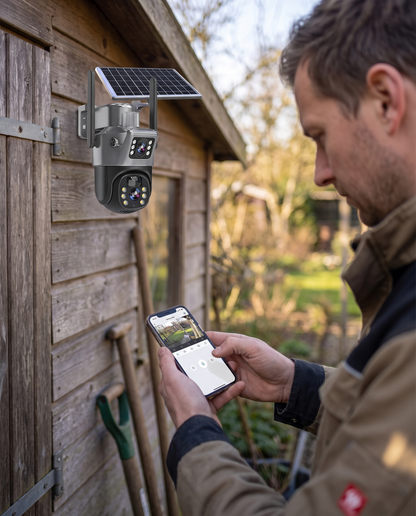 Mann nutzt per Smartphone-App die Solar-Sicherheitskamera im Garten