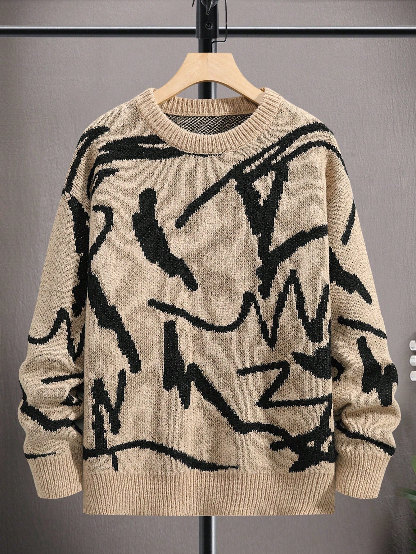 Beiger Strickpullover mit schwarzem abstraktem Muster, Unisex, Baumwolle, modisch, Herbstmode.