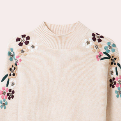 Beiger Pullover mit floralen Stickereien, Damenmode, Strick, Blumenmuster, modisch, elegant.