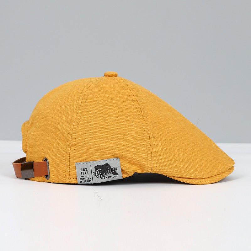 Gelbe Schiebermütze aus Baumwolle mit verstellbarem Riemen, modisches Accessoire für Herren.