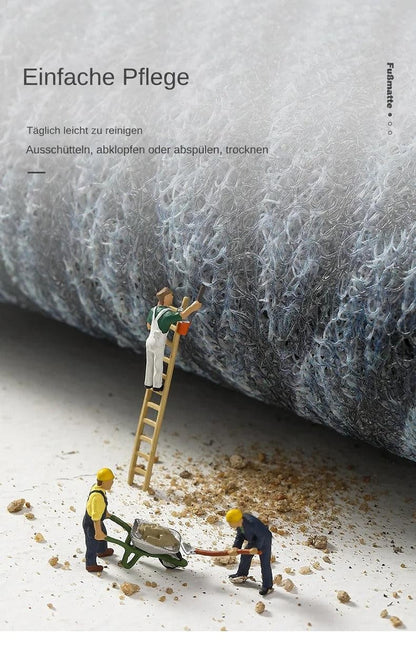Detail der weichen, verschlungenen Mattenfasern mit Miniaturfiguren, die auf einer Leiter und mit Schubkarre Schmutz 12