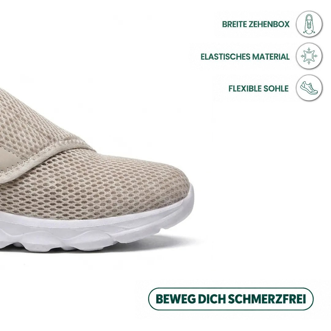 Detailansicht der breiten Spitze des beigen Netzschuhs mit weißer Sohle, dazu Hinweise auf elastisches Material und flexible Sohle. 32