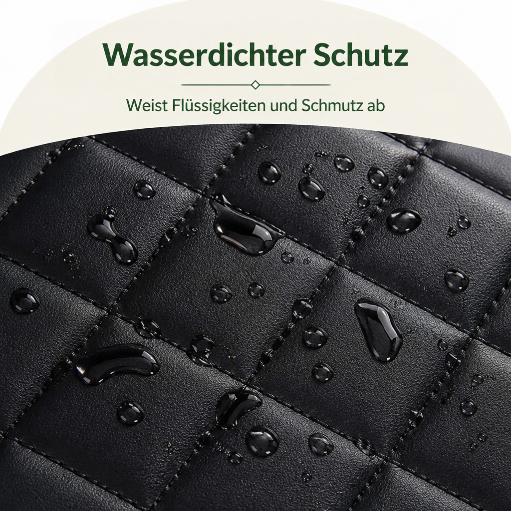 Nahaufnahme der schwarzen Steppoberfläche mit Wassertropfen, die auf dem glatten Material abperlen und die wasserabweisende Wirkung zeigen. 3