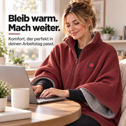 Frau arbeitet am Laptop an einem Holztisch, eingehüllt in die rote Decke mit grauem Futter 11