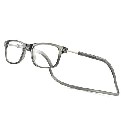 Transparente graue Lesebrille mit eckigem Rahmen und Nackenband, schräg von vorne auf hellem Hintergrund.