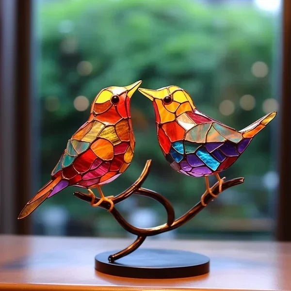 Zwei einander zugewandte Vögel in Orange, Rot und Violett auf einem geschwungenen Zweig mit schwarzer runder Basis 4