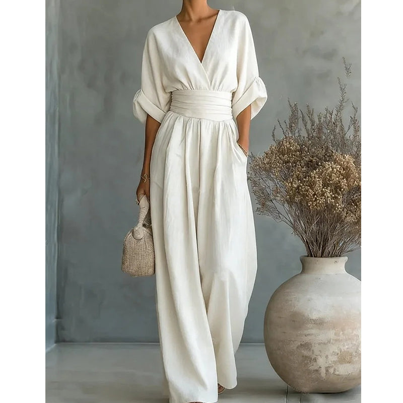 Cremeweißer Damen-Jumpsuit mit Taillenband, Ärmelaufschlag und weiter Hose, detail