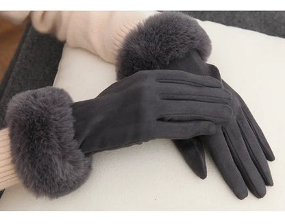 Damenhandschuhe aus grauem Wildleder mit Kunstpelzbesatz, elegant und warm für den Winter.