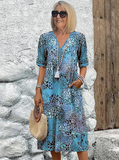 Schickes Midi-Kleid in Blau mit schwarzem Tupfenmuster, Detail