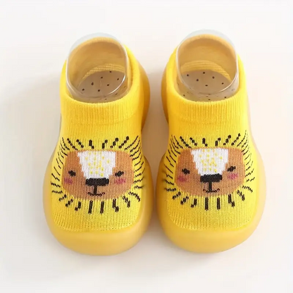 Gelbe Babyschuhe mit Löwenmotiv, rutschfest, aus Baumwolle, ideal für Kleinkinder.