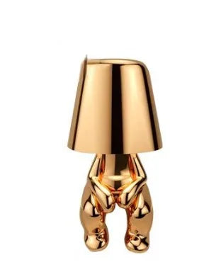 Goldene Tischlampe in menschlicher Form, modernes Design, dekorative Beleuchtung.