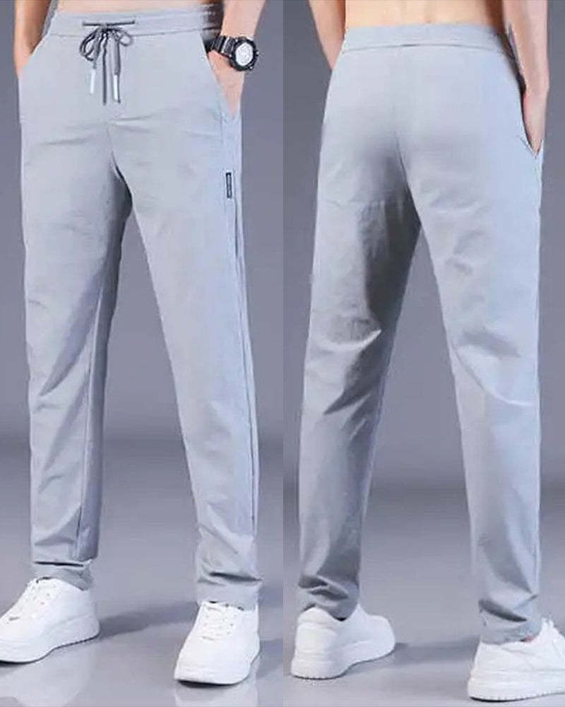 Graue Herren-Sporthose, atmungsaktiv, elastisch, ideal für Fitness und Freizeit.