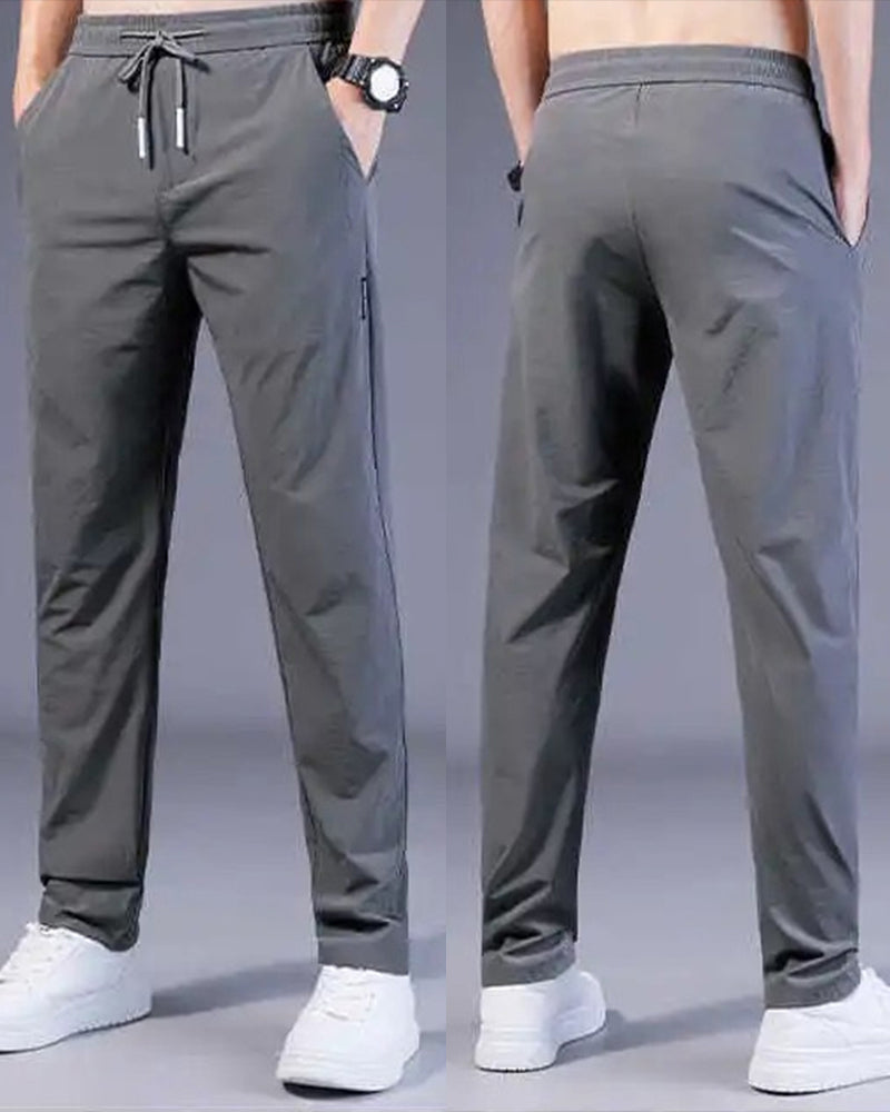 Graue Herren-Sporthose, atmungsaktiv, elastisch, mit Kordelzug, ideal für Fitness und Freizeit.