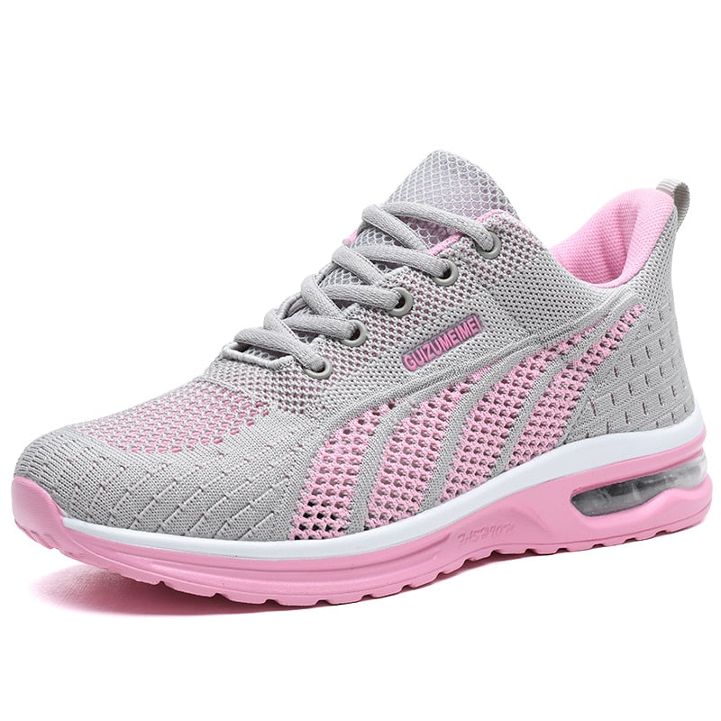 Grauer und rosa Damen-Sneaker, atmungsaktiv, mit Mesh-Obermaterial und Gummisohle.