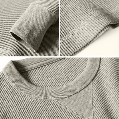 Grauer Strickpullover aus Baumwolle, Nahaufnahme, Texturdetails, modisch, bequem, langlebig.