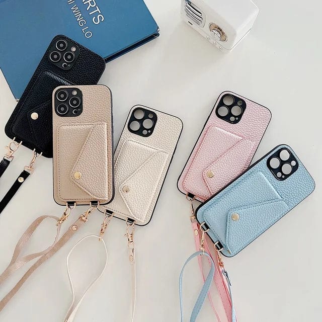 Crossbody-Handyhüllen mit Kordel für iPhone, Samsung in Schwarz, Beige, Rosa, Blau auf Tisch.