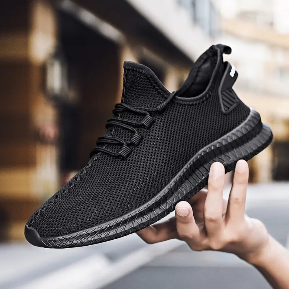 Schwarzer Herren-Sneaker, atmungsaktives Mesh, sportlich, modisch, bequem.