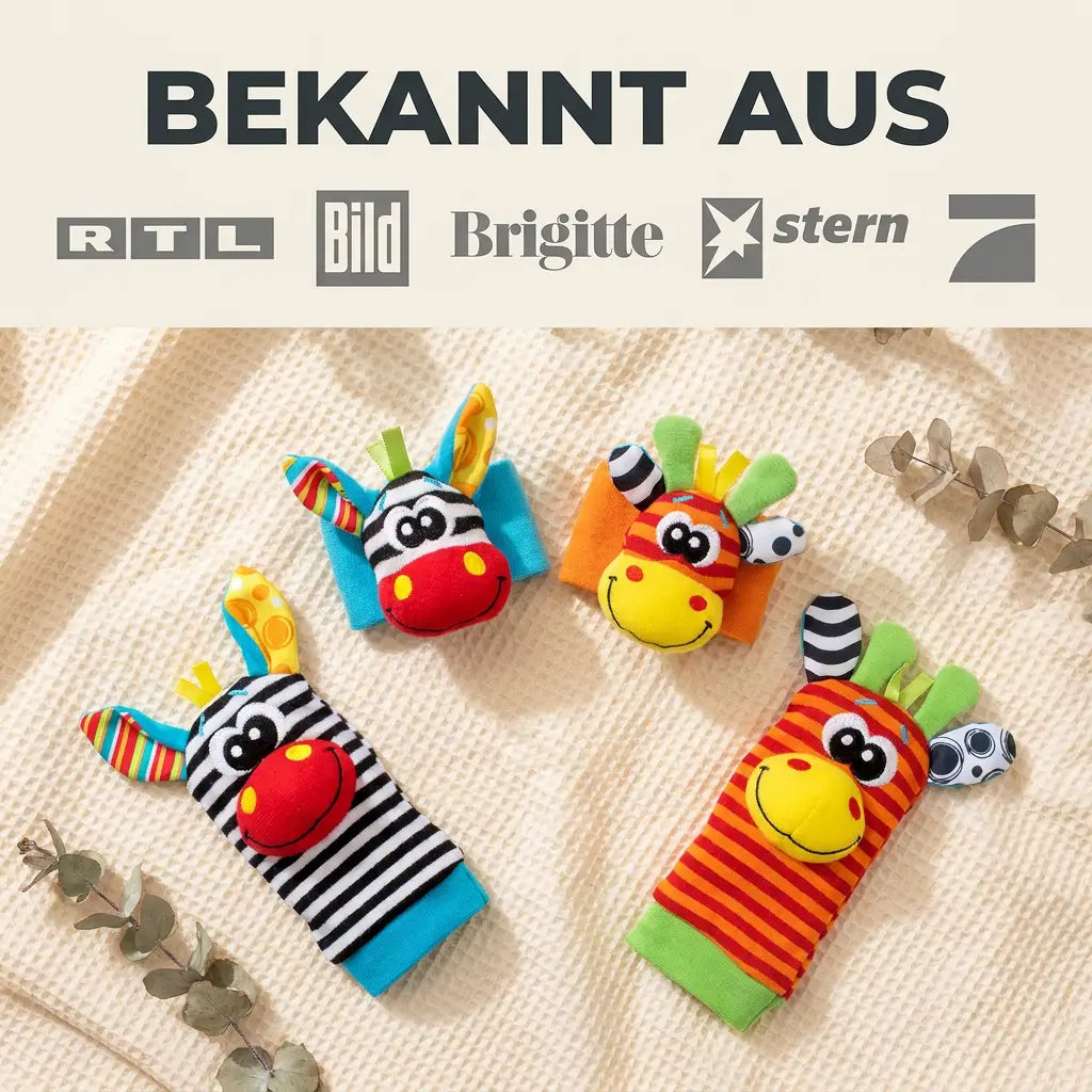 Baby Hand und Fuß Rassel Socken Set mit Zebra- und Giraffenmotiv auf einer Decke