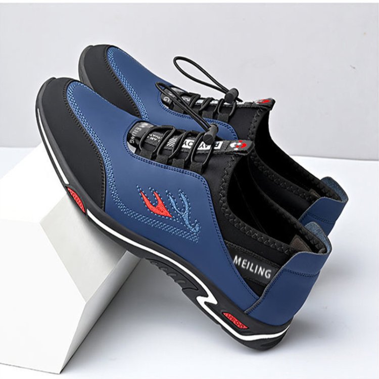 Blaue Herrenschuhe, stilvoll und bequem, mit schwarzem und rotem Detail, sportliches Design.