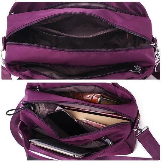 Lila Umhängetasche aus Nylon mit mehreren Fächern, ideal für Reisen und Alltag.