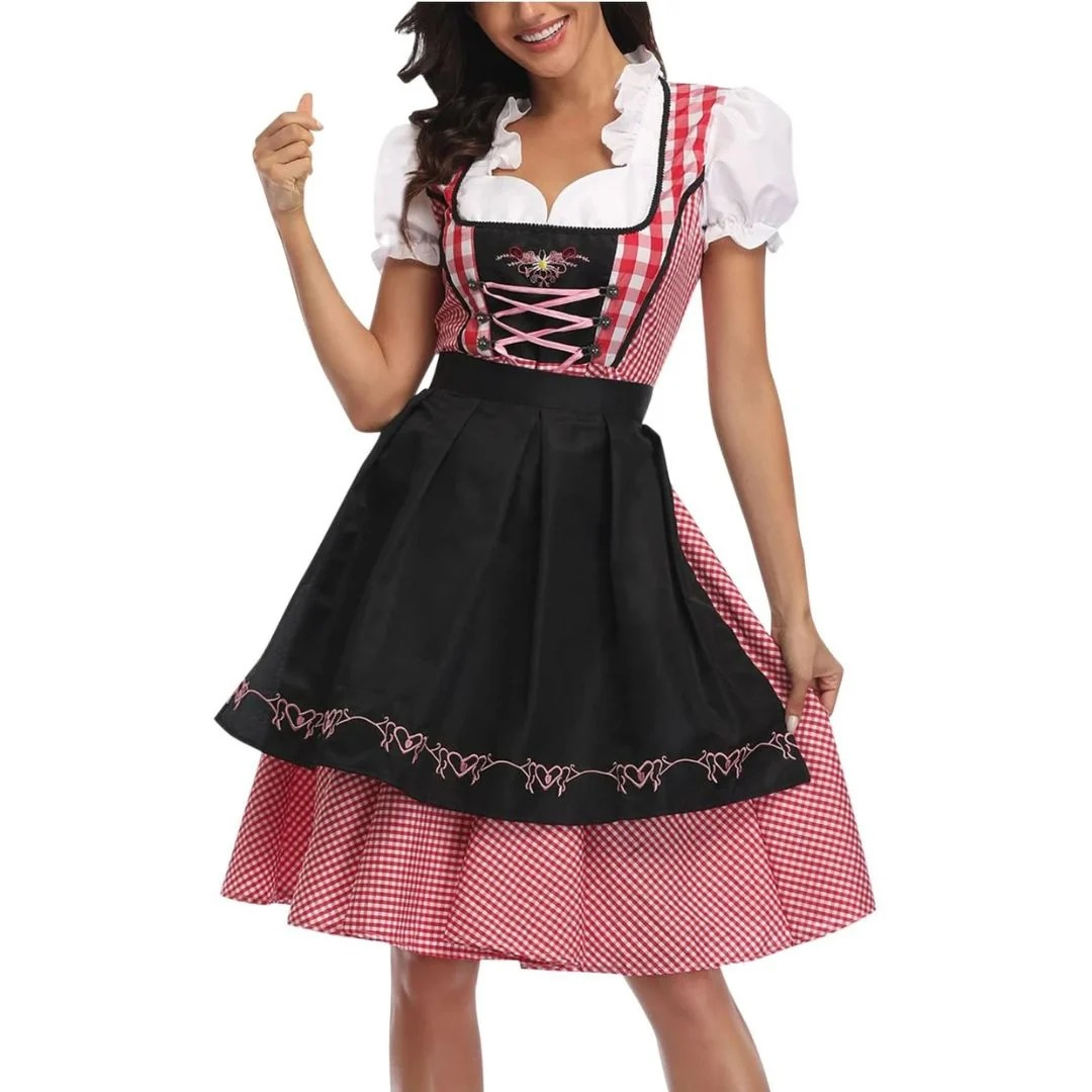 Dirndl mit rot-weiß kariertem Mieder, rosa Schnürung und schwarzer bestickter Schürze